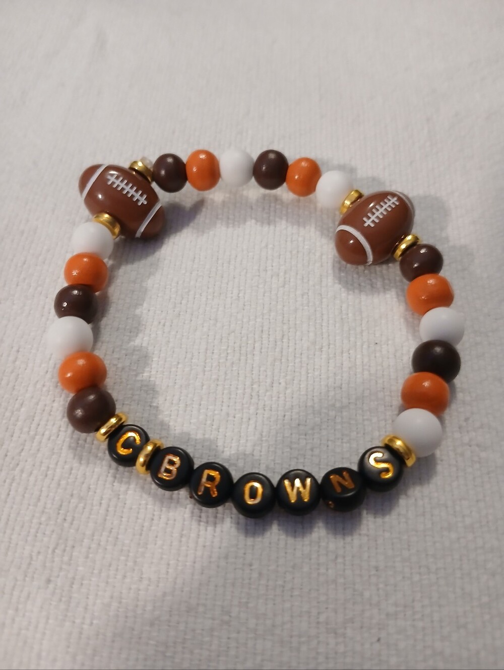 NWT Handcrafted C-Browns Themed Football Beaded Bracelet. Orange, Brown & White.